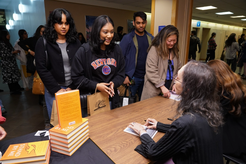 Joyce and Allison sign books